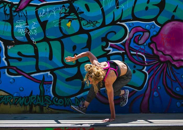 Helen Ilich, Front Kickthrough by colorful wall