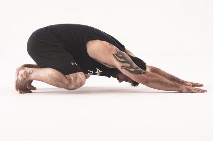 Animal Flow Master Instructor Andrew 'Chaddy' Chadwick performs a Loaded Beast