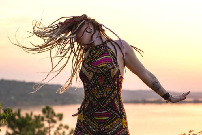 Woman dancing as the sun sets